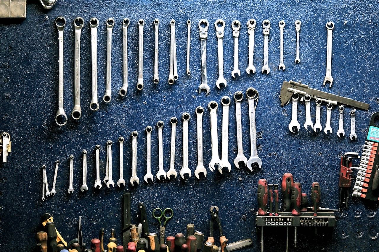 Mechanic tools organized on workshop wall